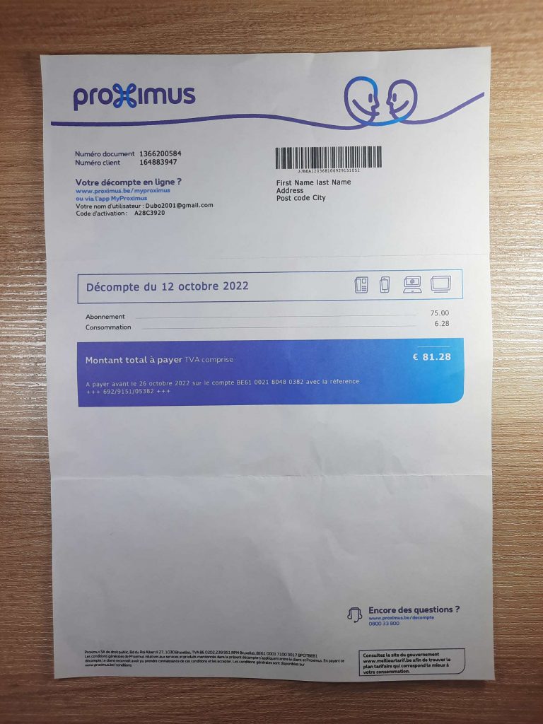 Official-looking Proximus bill from Belgium shown on wood surface