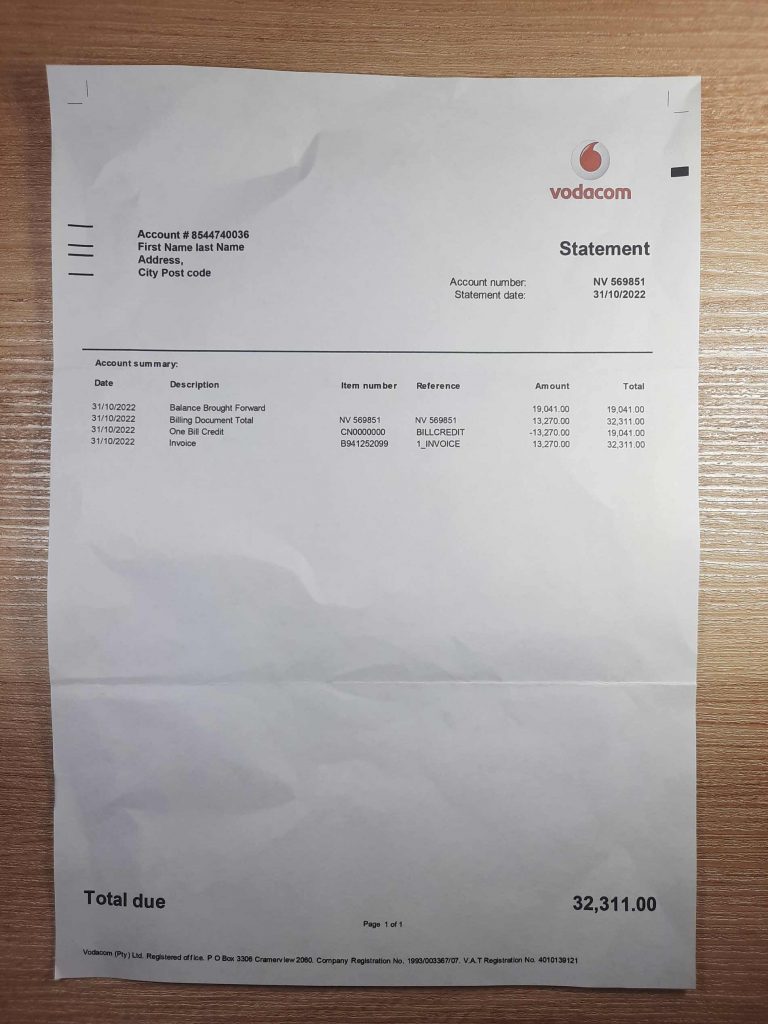Tanzania Vodacom phone utility bill displayed on desk