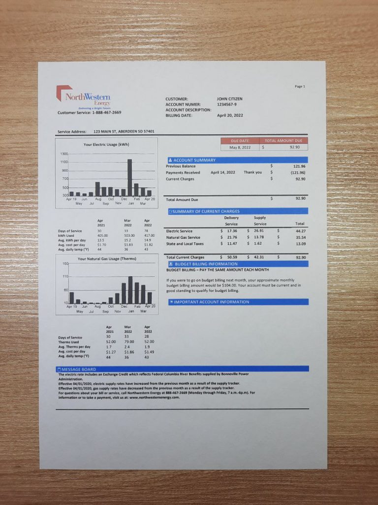 Utility proof from South Dakota NorthWest Energy shown on desk