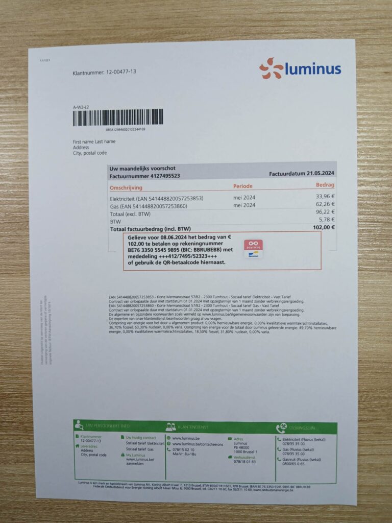 Belgium Luminus residential bill displayed on a table